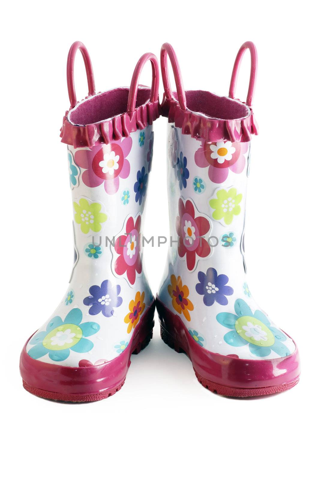 Pair of little girl's fun rain boots galoshes with water droplets on them