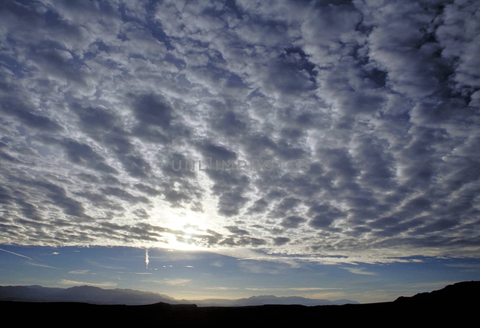 Clouds and Sun over Orca Inlet in Alaska