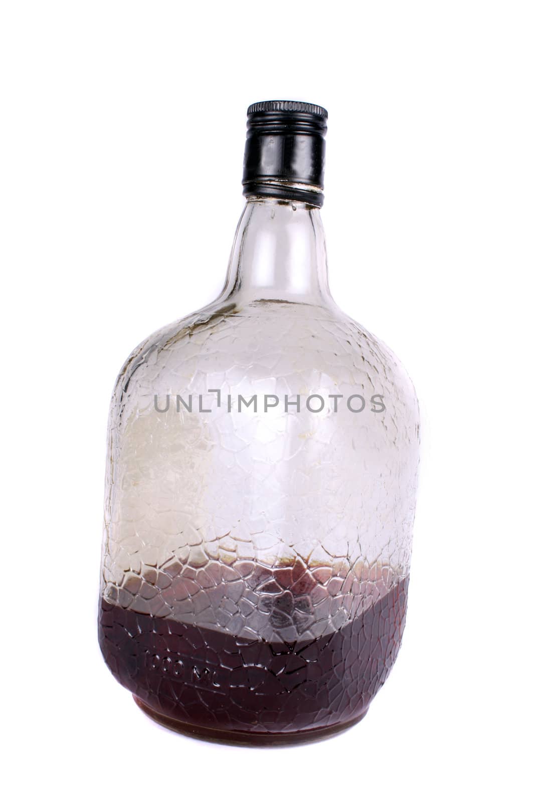 A bottle containing rum, on white background.