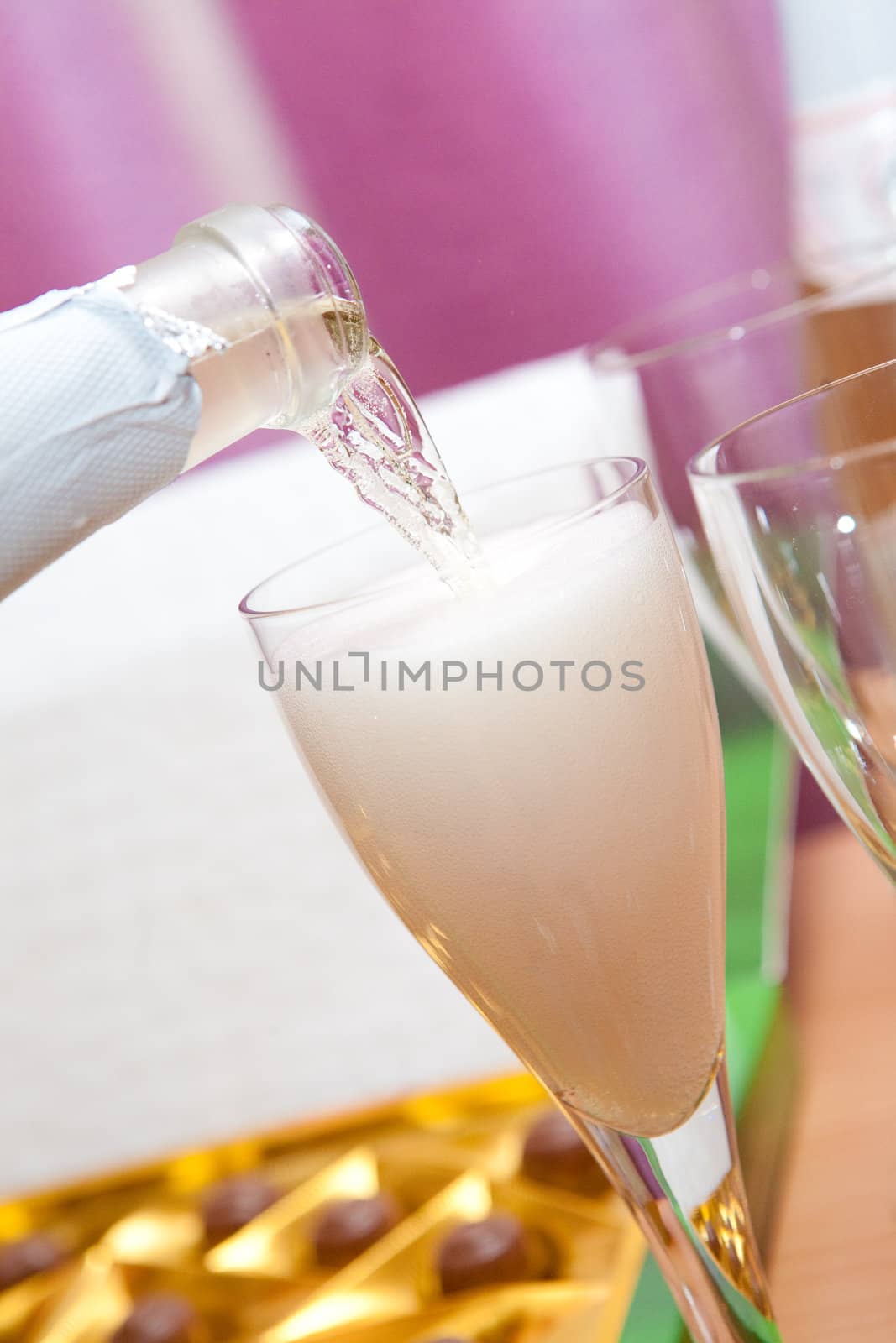 pouring champagne in a glass