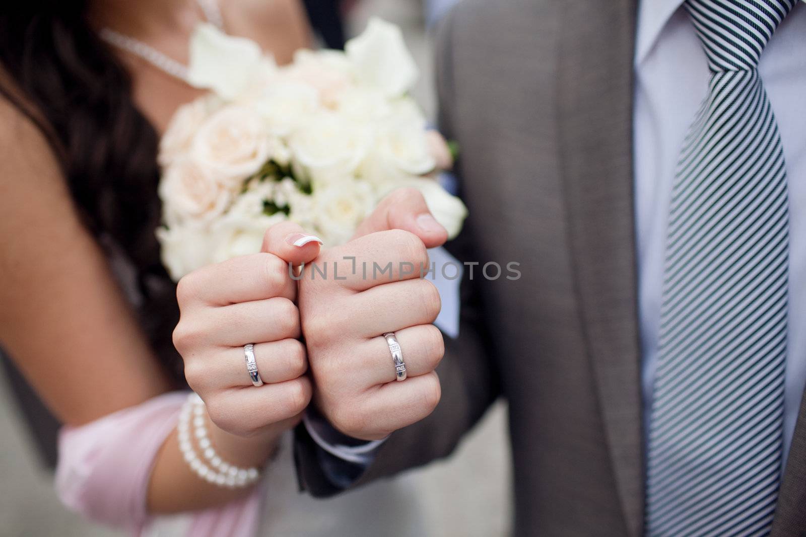 fists of bride and groom