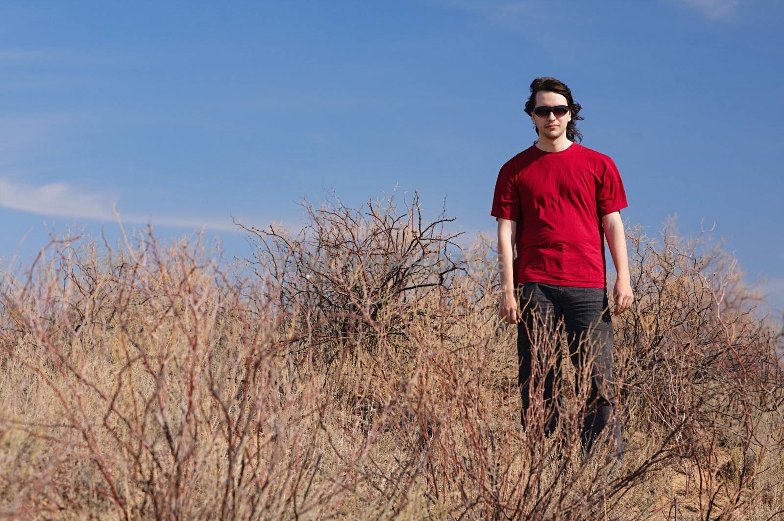 man in red shirt outdoors 