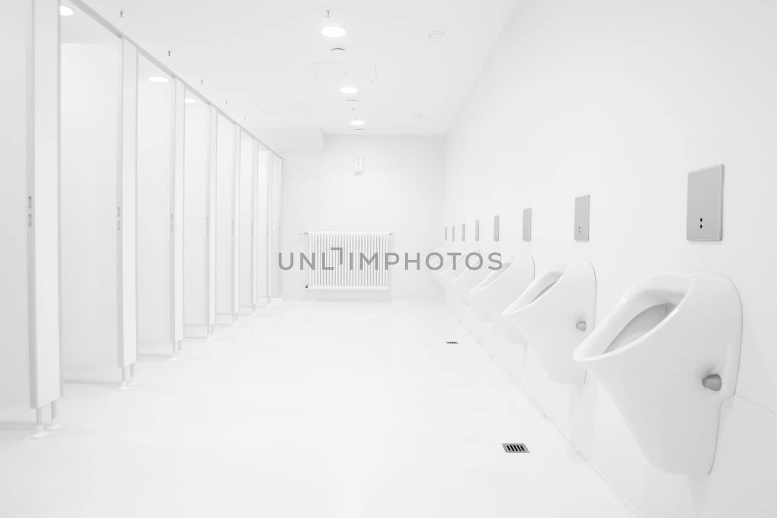 a clean new public toilet room empty