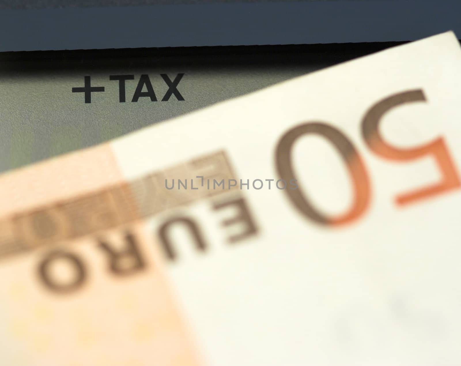 Tax time concept. Calculator and euro bill close up, shallow dof