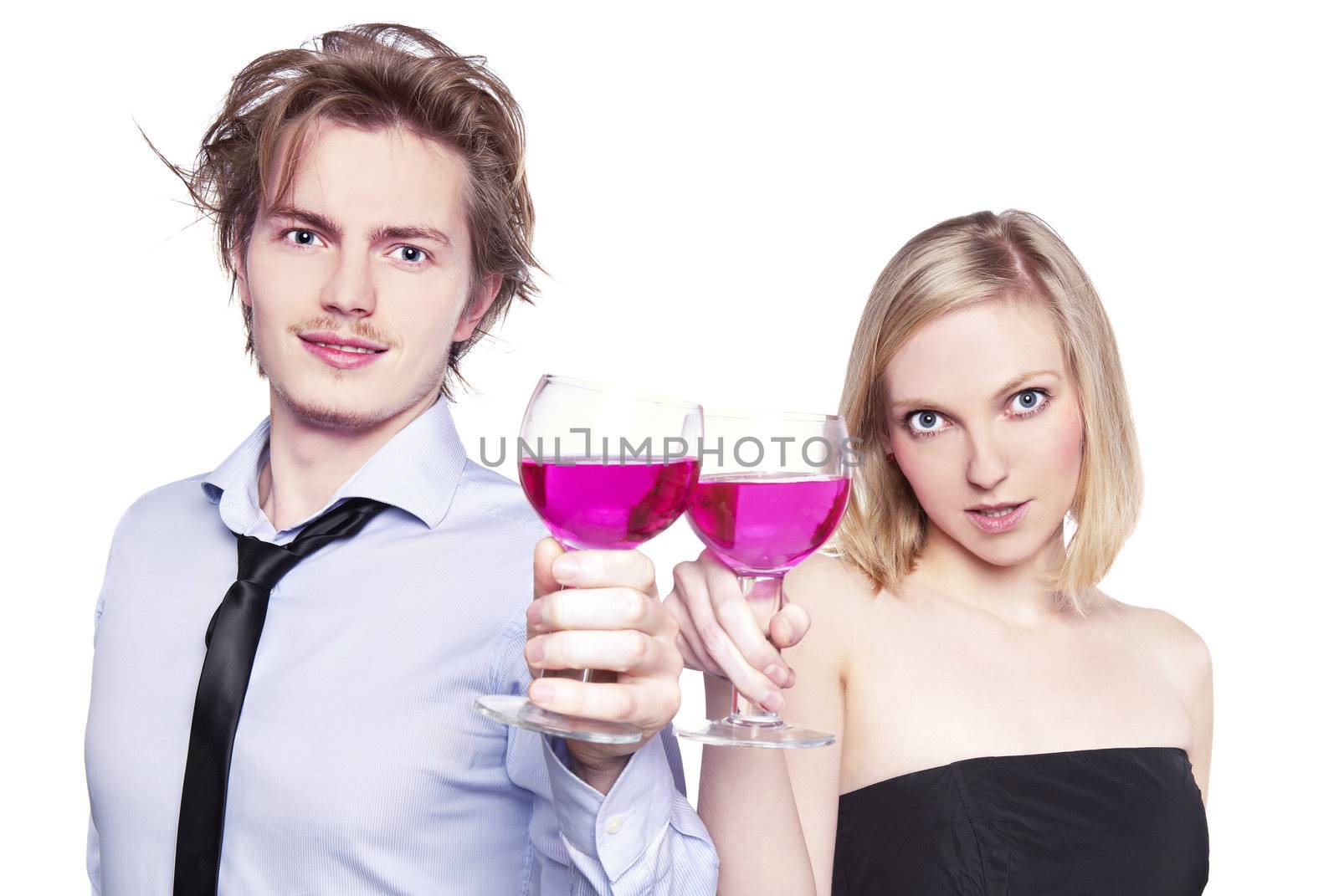 Young couple toasting with pink drink. Two people drinking. Studio photo, isolated.