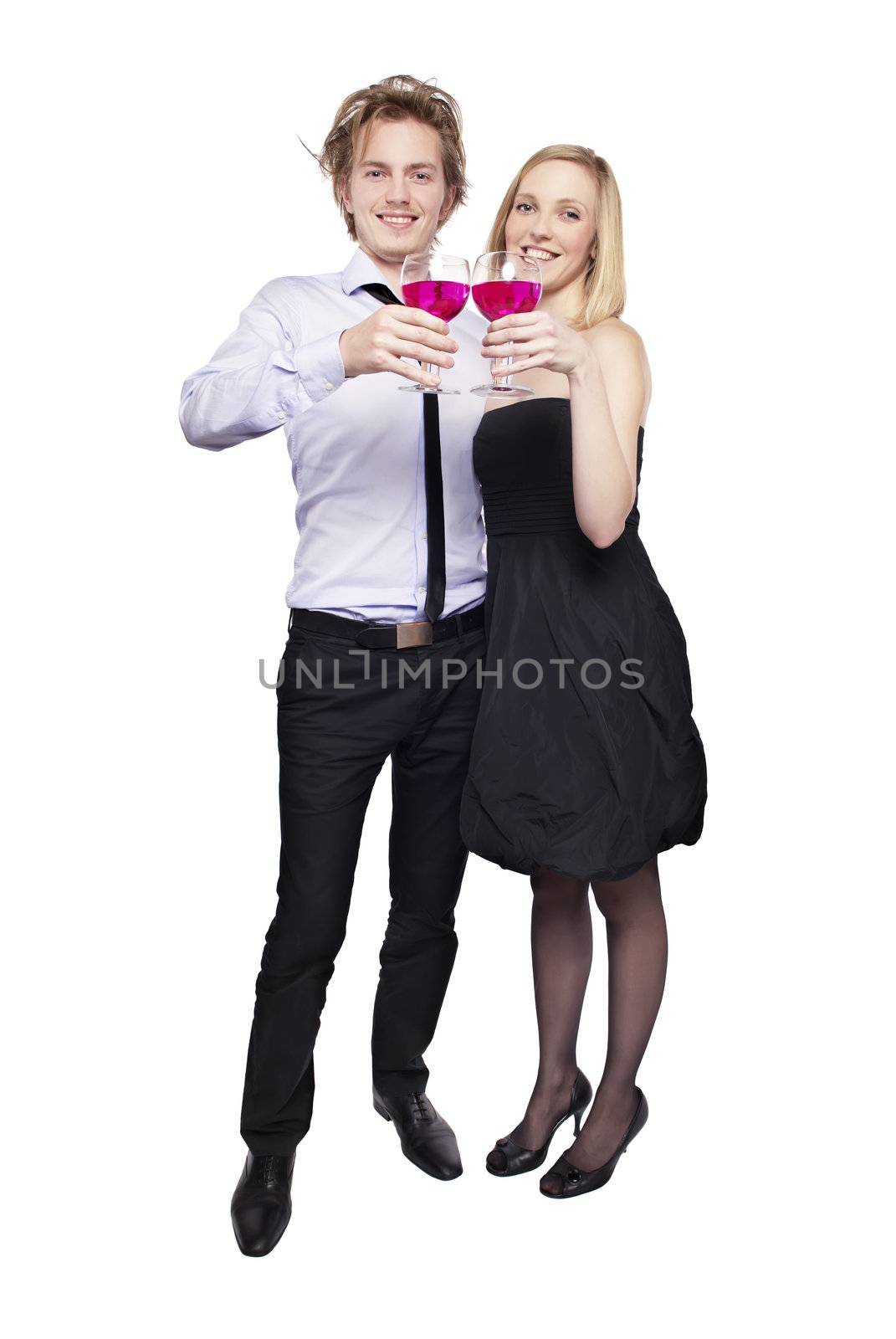 Young couple toasting with pink drink. Two people drinking. Studio photo, isolated.