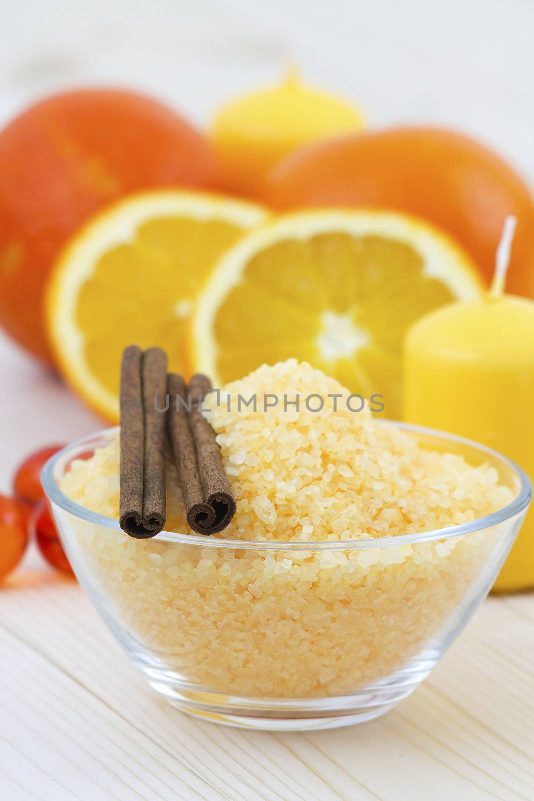 bowl of orange bath salt with fresh fruits - beauty treatment by miradrozdowski
