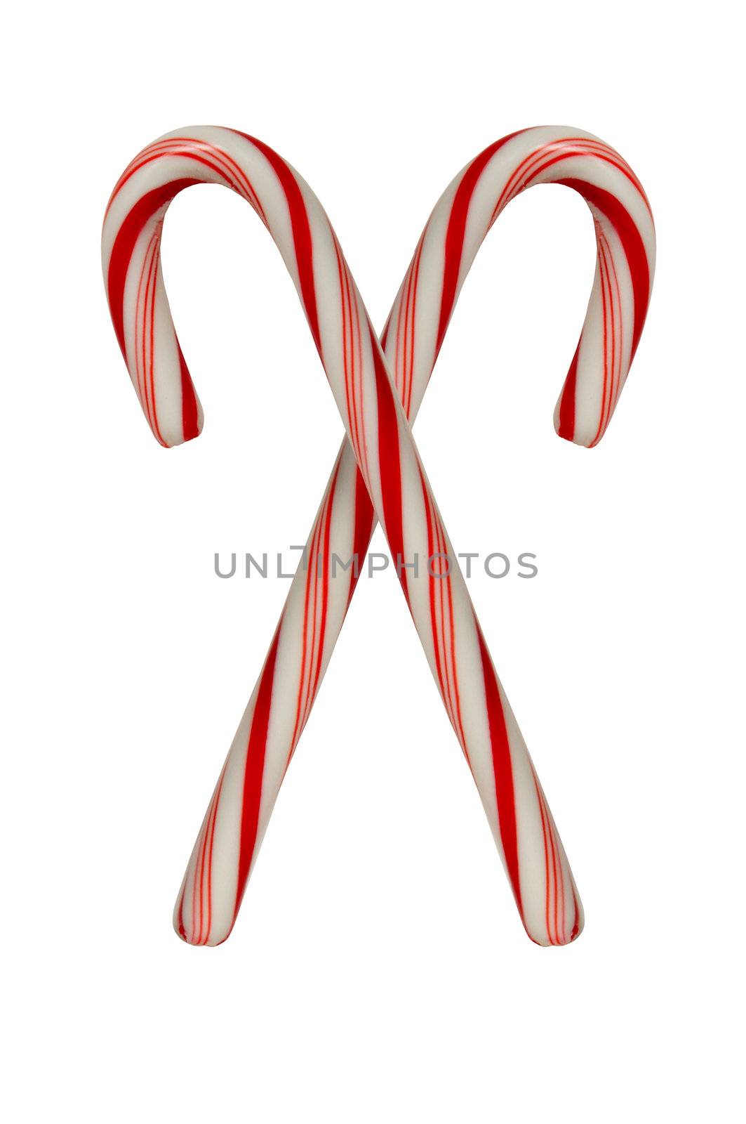 Two crossed candy canes on white background