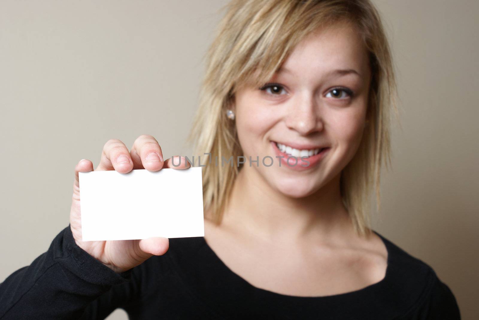A smiling woman presents a blank card for your messages to be inserted with ease.