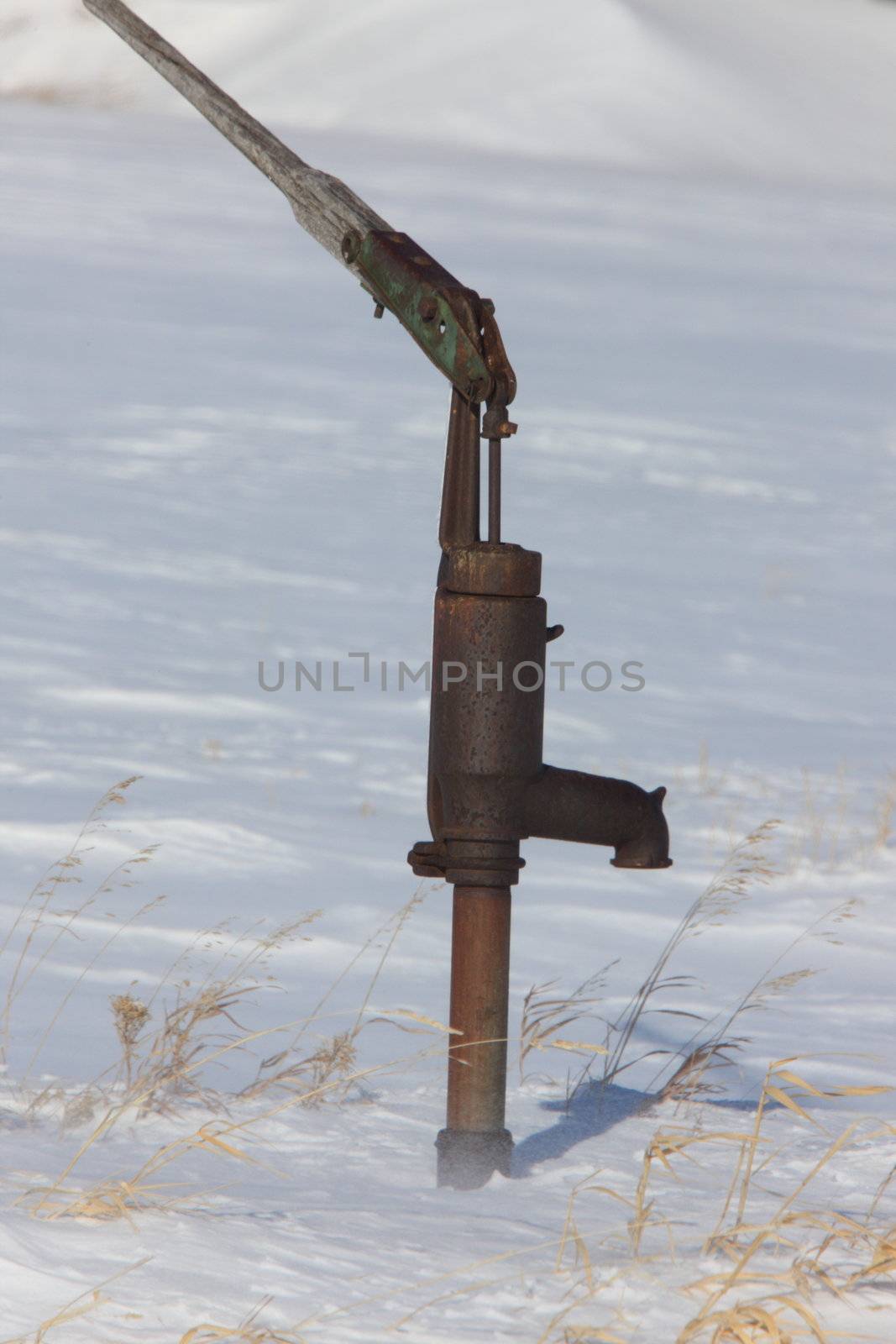 Old Water Pump in Winter by pictureguy