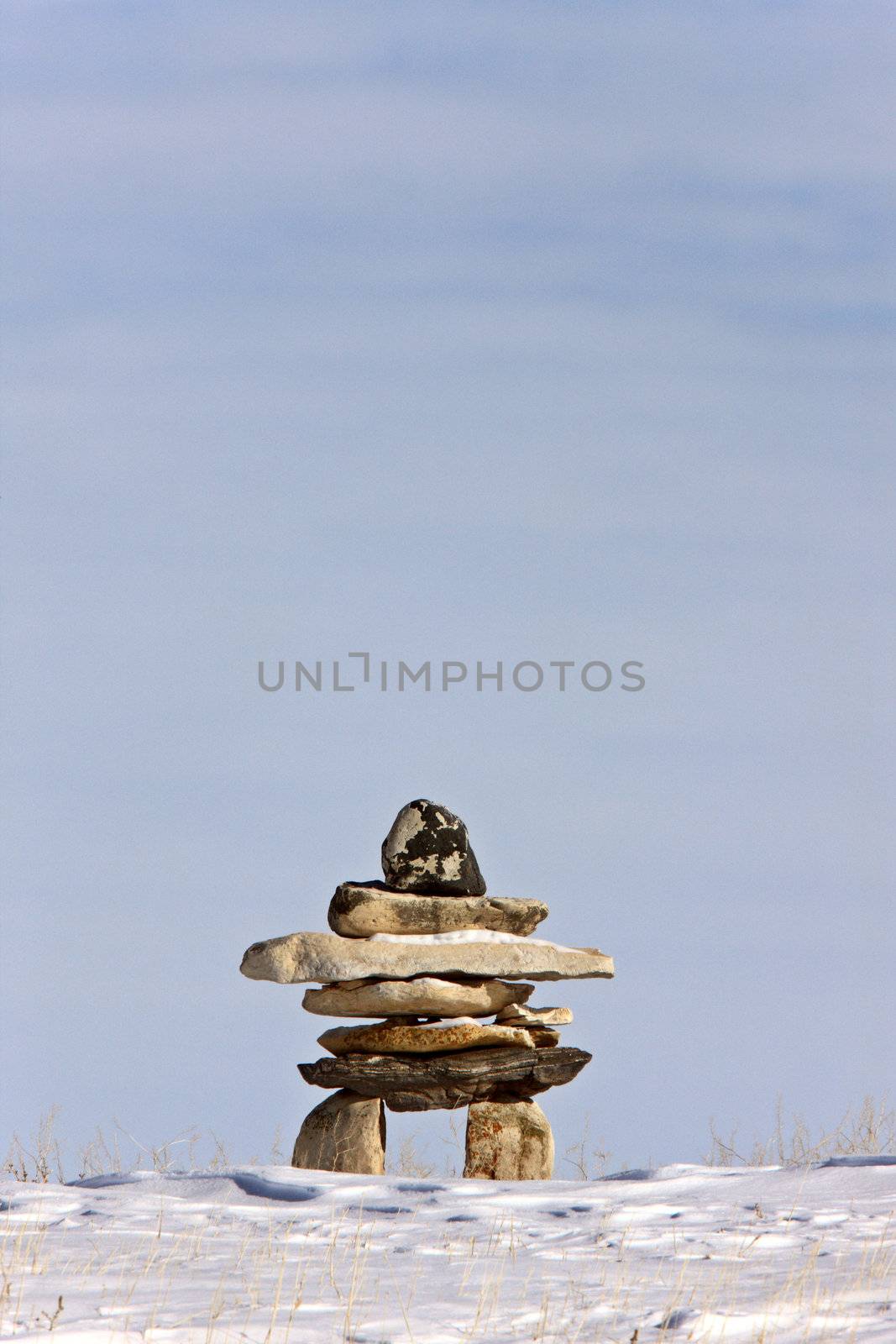 Inukshuk in Winter Canada by pictureguy