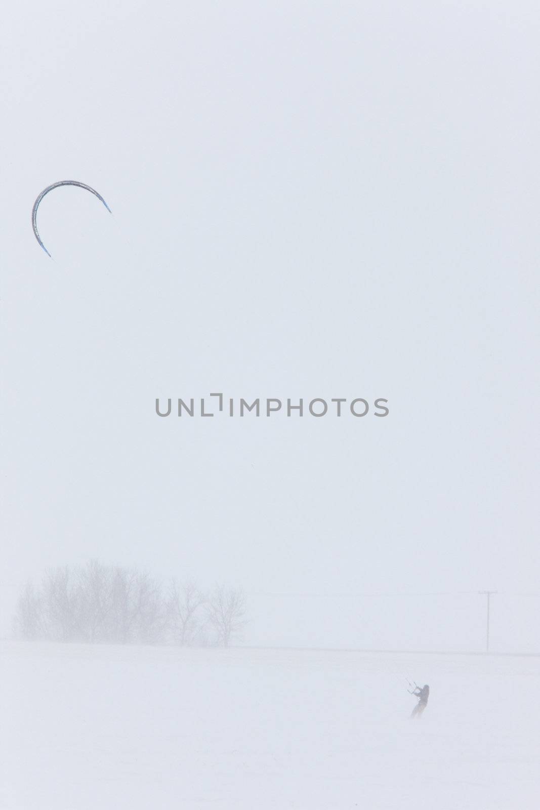 Parachute and Snow Boarding in Blizzard by pictureguy