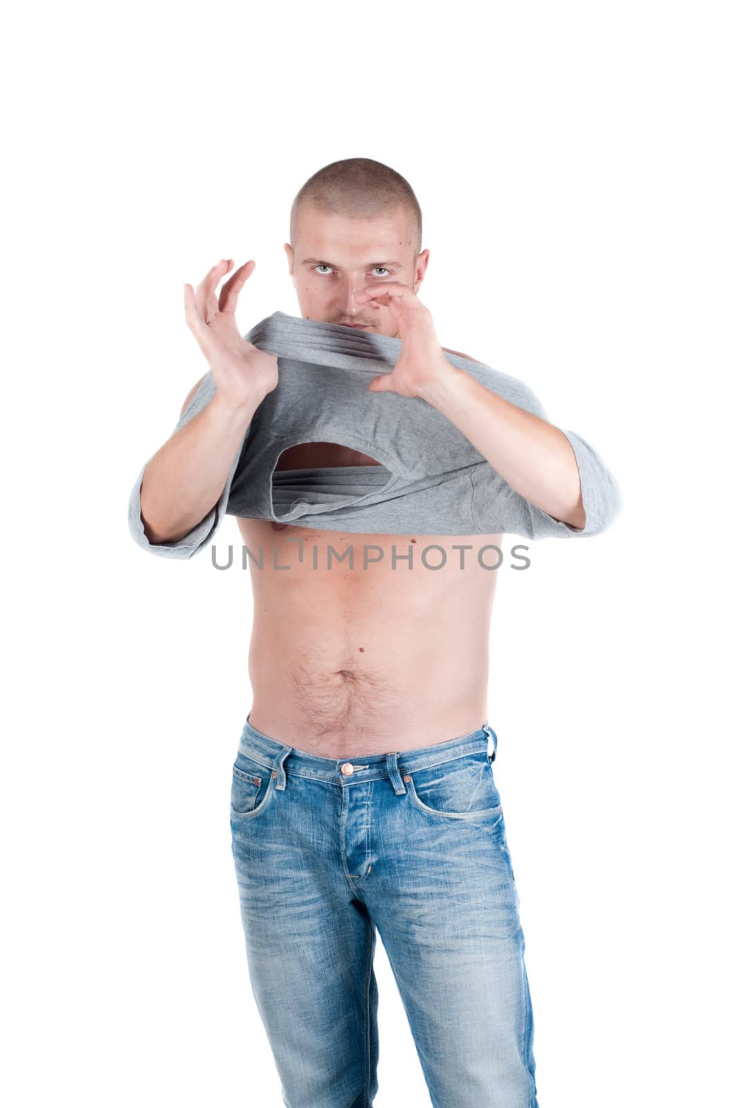 Studio shot o man isolated on white getting dressed
