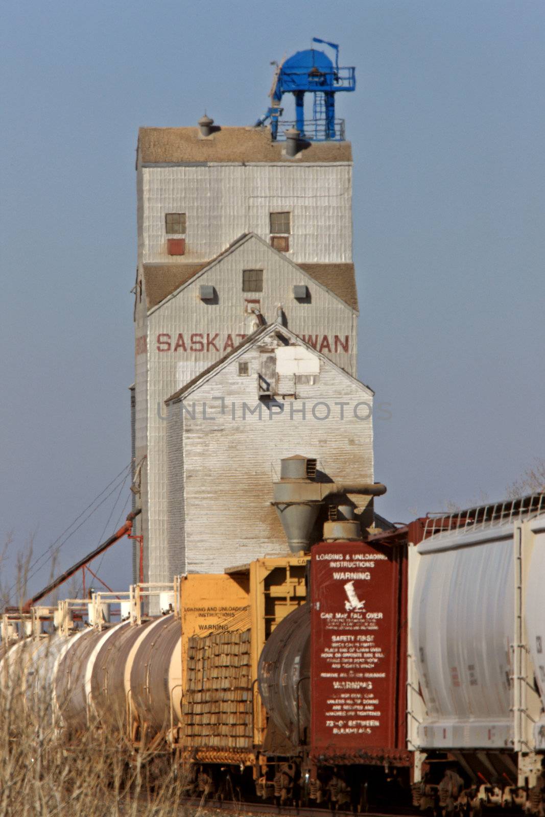 Grain Elevator and Train Saskatchewan by pictureguy