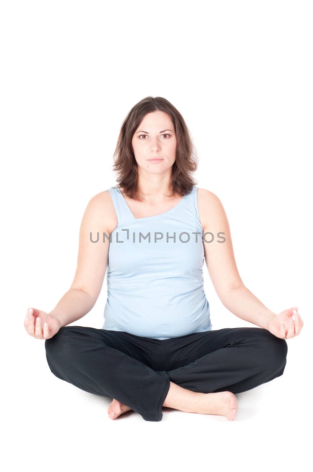 Portrait of pretty pregnant woman practicing yoga by anytka