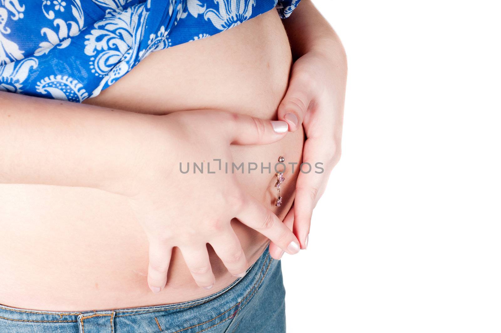 Pregnant woman holding her hands in form of heart sign on her belly