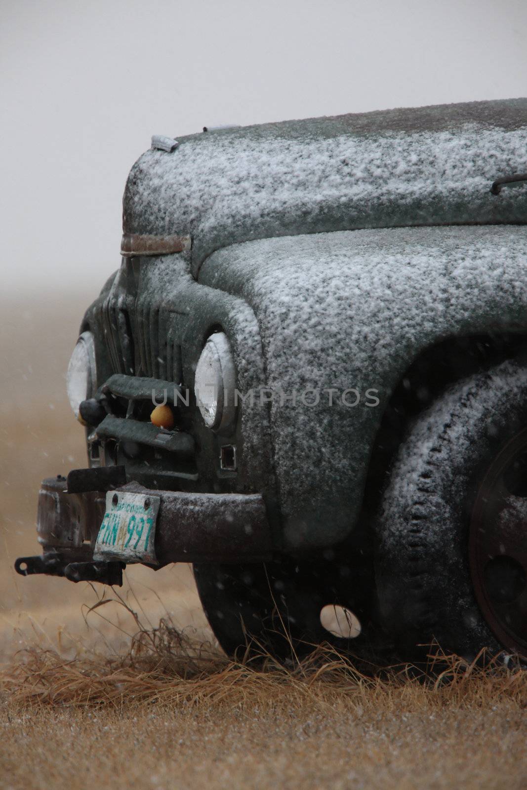 Old Vintage Truck in Winter Storm Saskatchewan by pictureguy