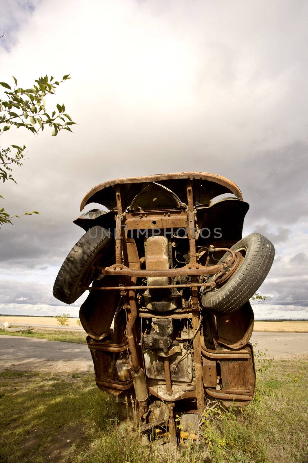 Antique truck sticking out of ground in Saskatchewan Canada by pictureguy