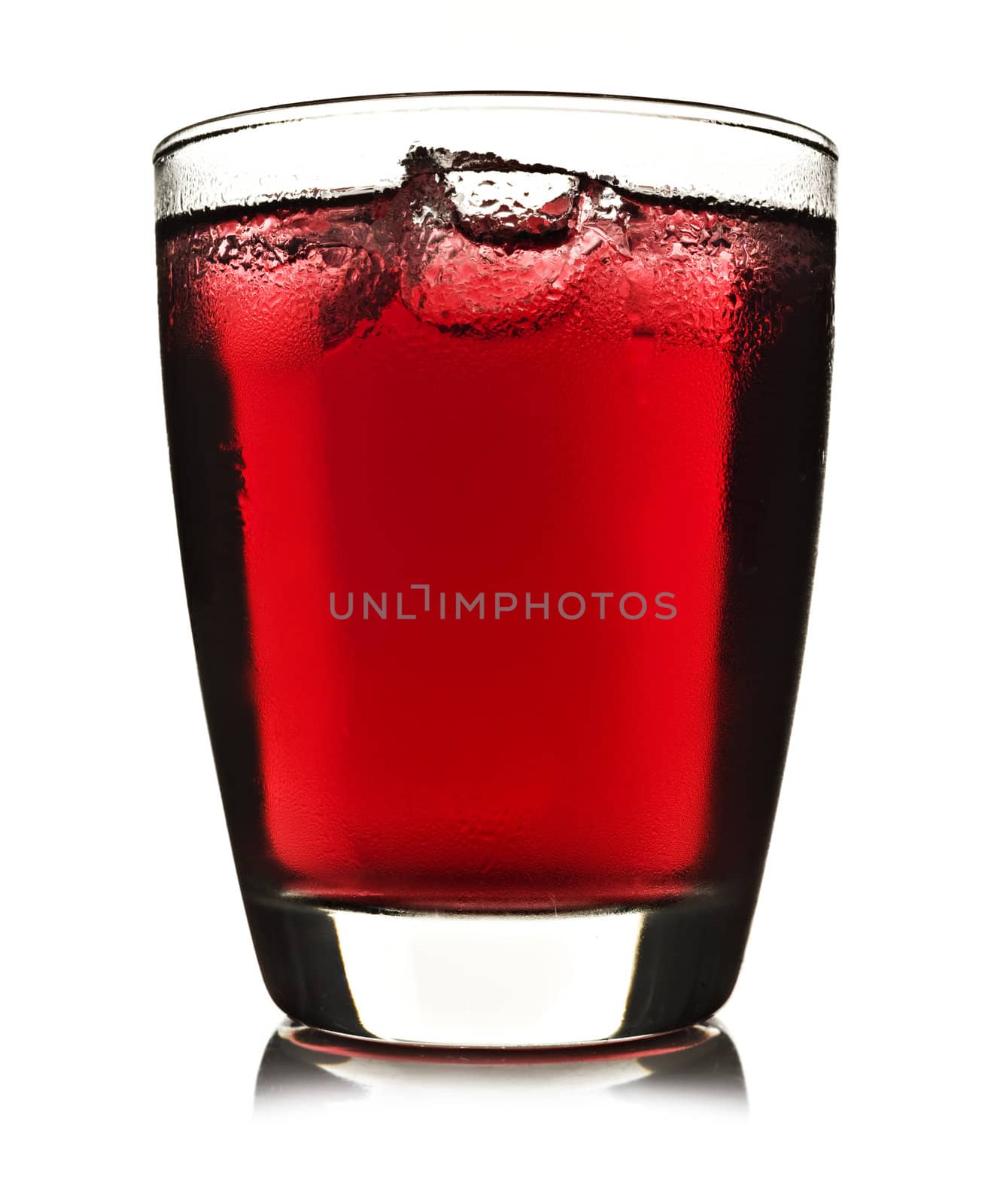 One glass of red fruit juice with ice on a white background