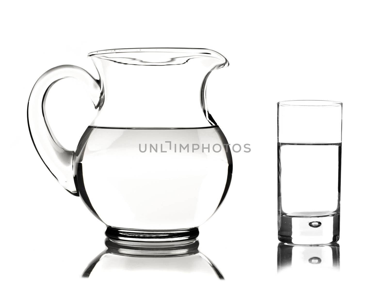 Glass and glass pitcher on white background by tish1