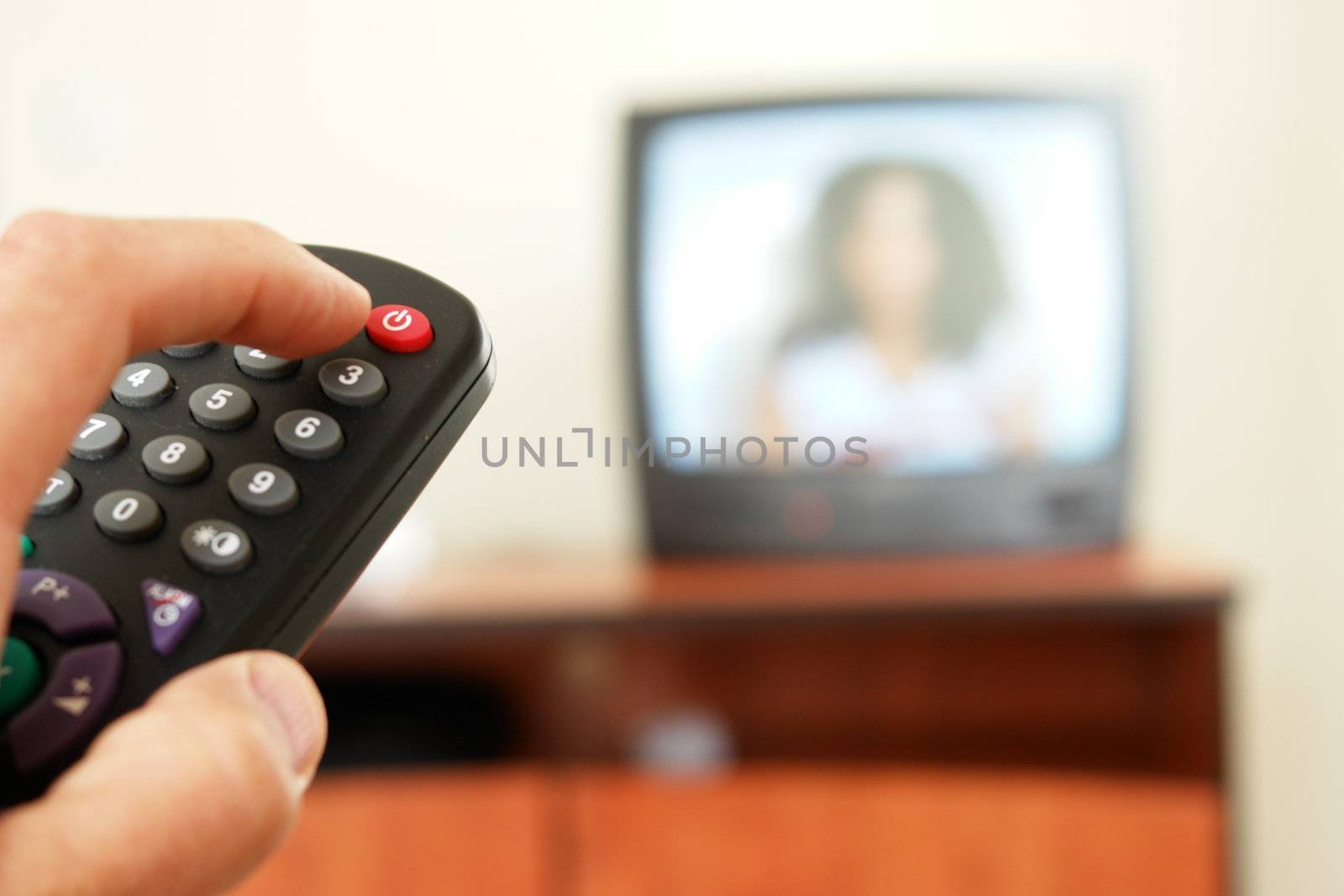 Television screen with tv remote control  in foreground.....