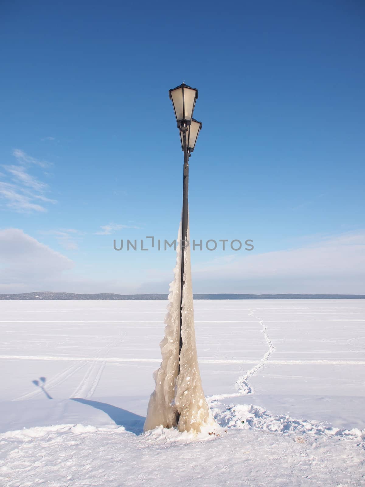 Lantern on the bank of lake in the winter 