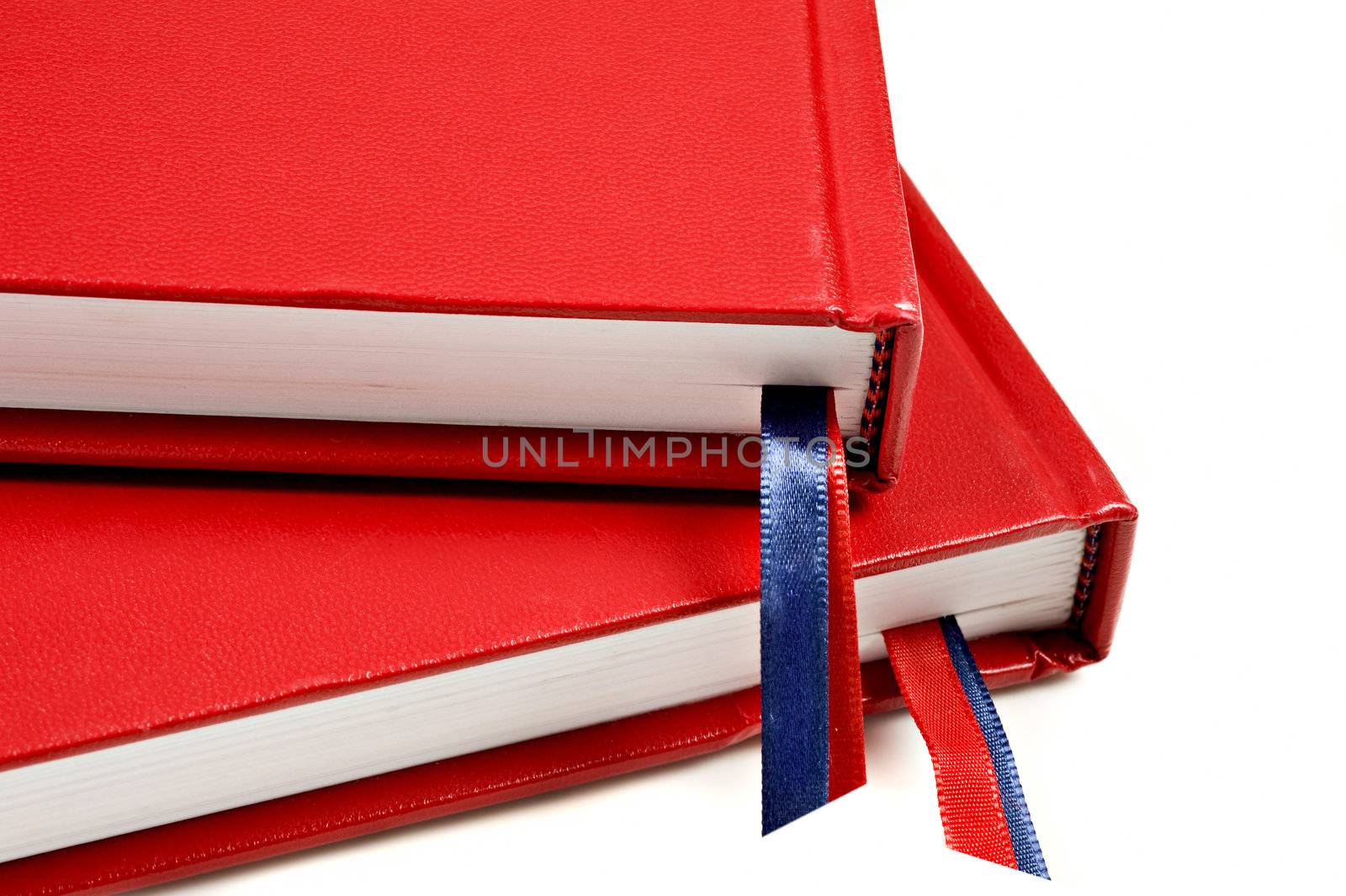 Close up of two red journals on white background by tish1