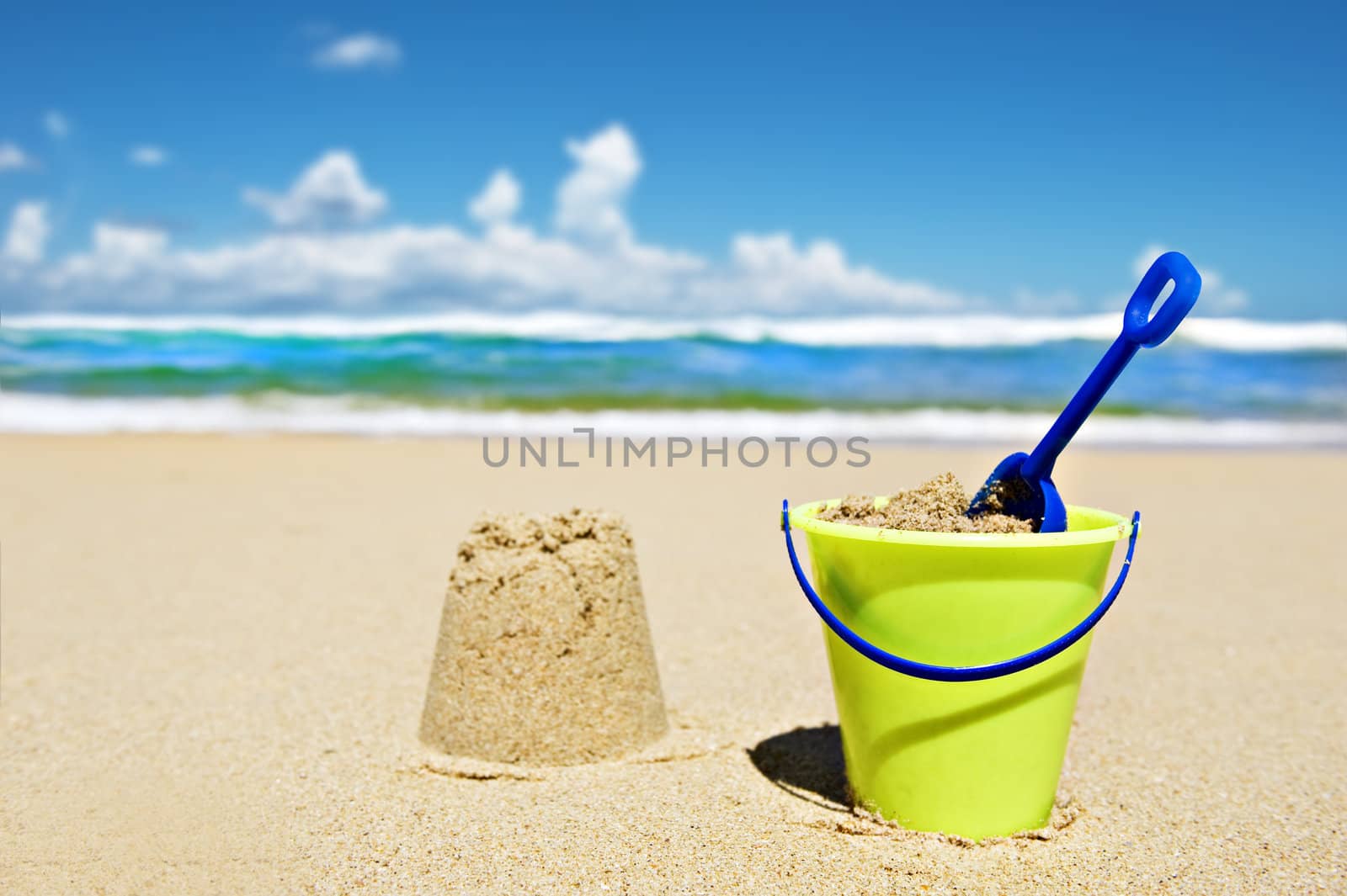 Toy bucket and shovel on the beach by tish1