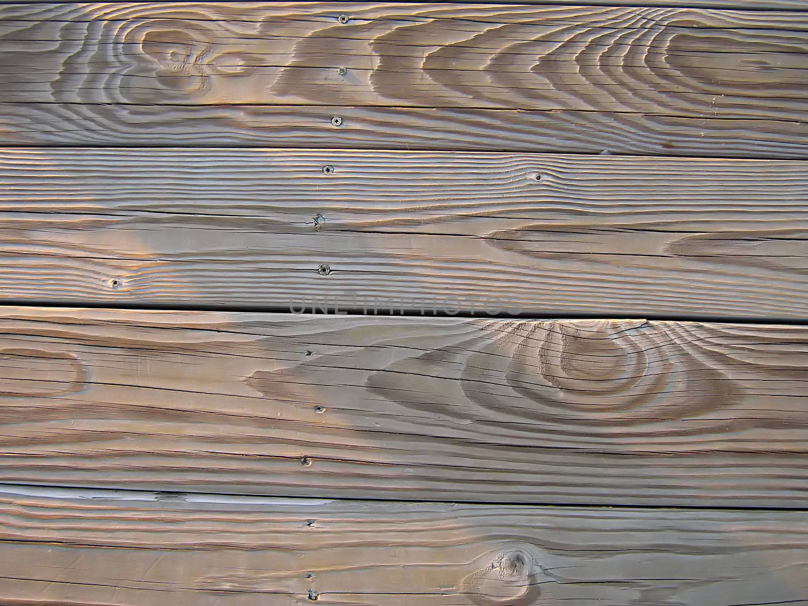 A photograph of wood boards detailing their texture and grain.