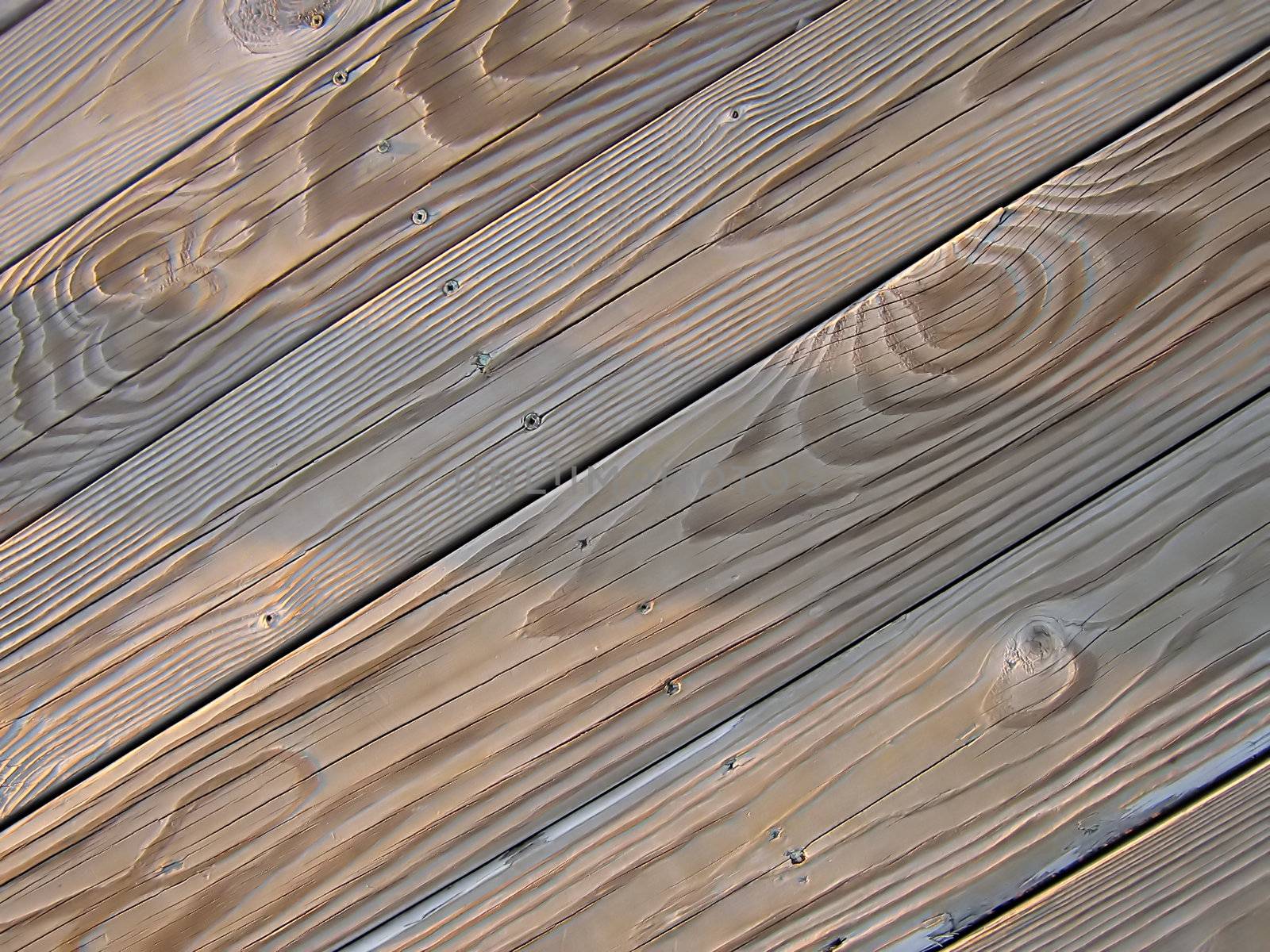 A photograph of wood boards detailing their texture and grain.