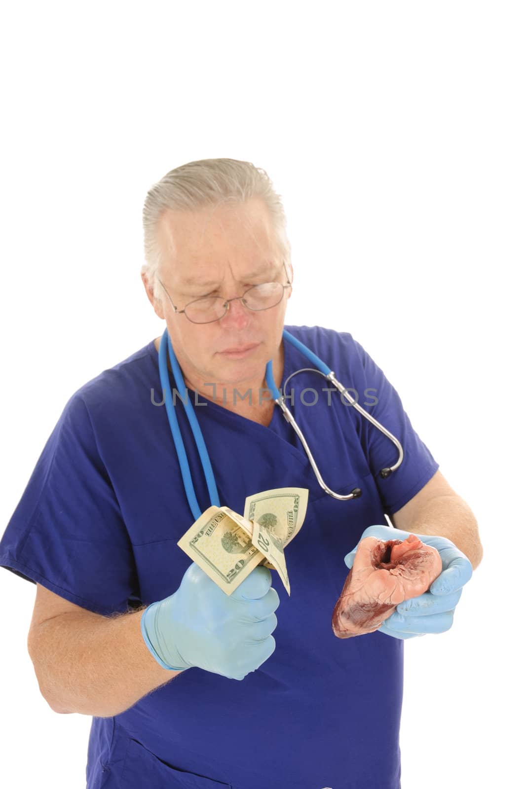 Doctor holding fist full of money repesentign the escalating costs of medical atention, and or body parts for sale