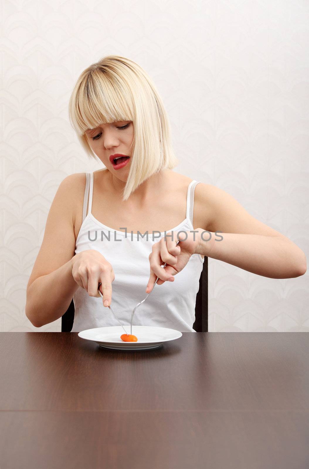 Beautiful caucasian girl eating her diet meal.