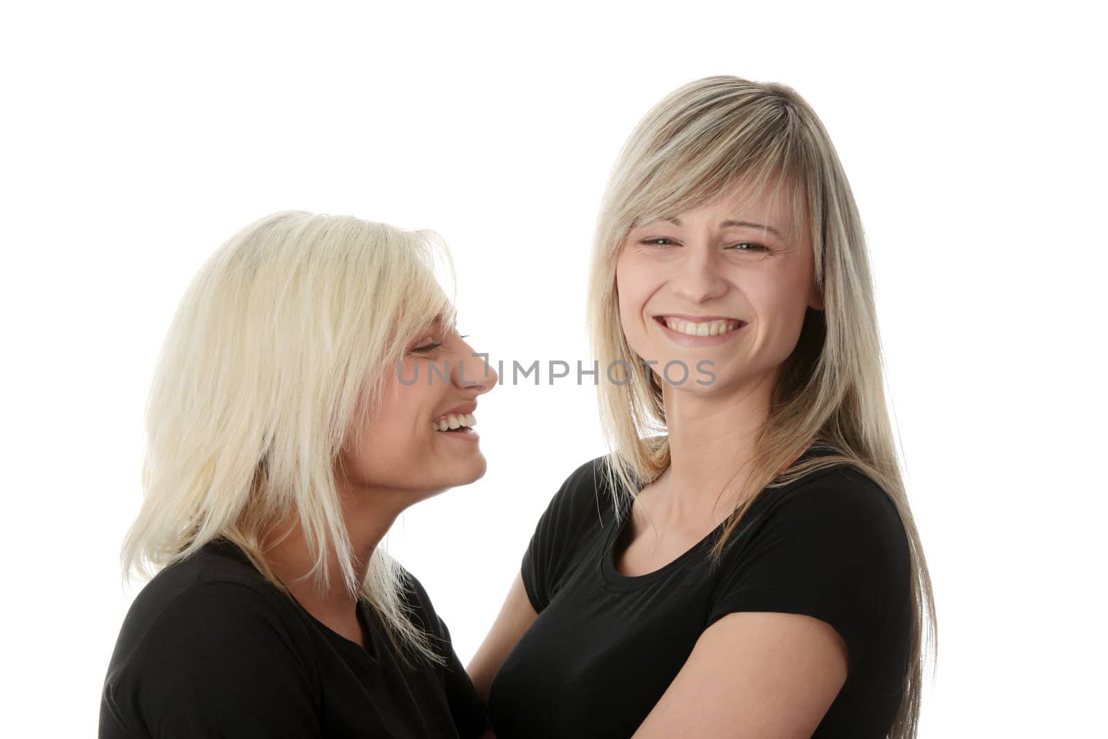 Happy young women friends laughing. Isolated on white background