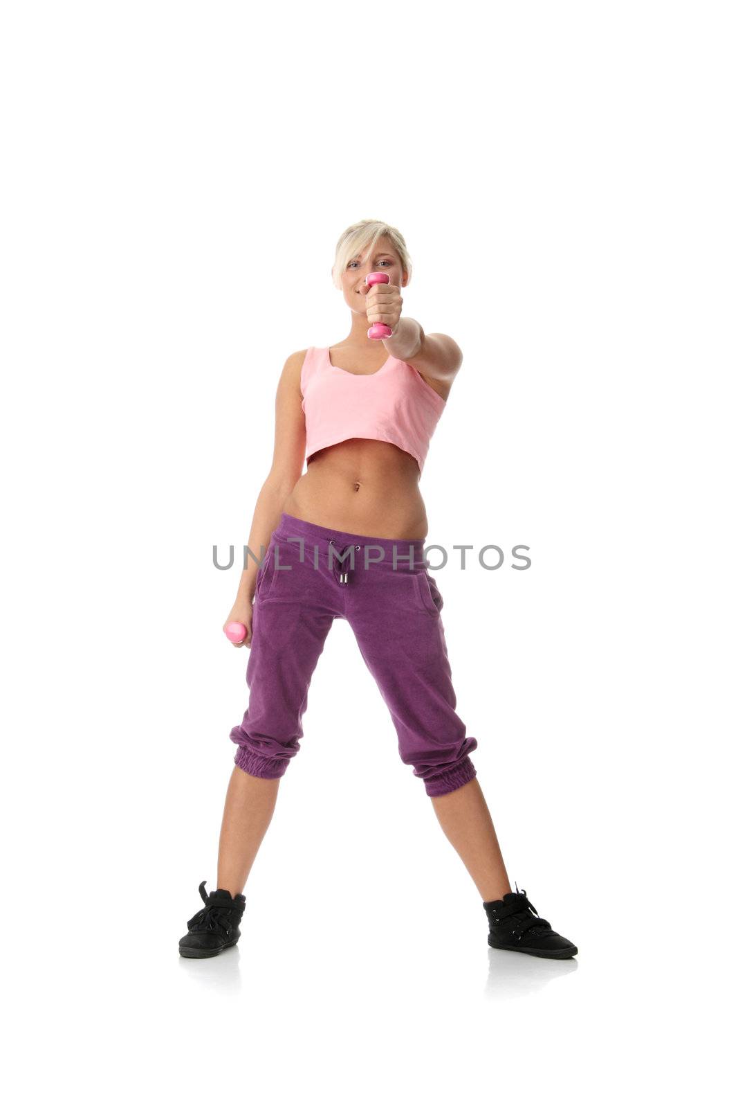 Young beautiful woman during fitness time and exercising with dumb-bell, isolated on white background