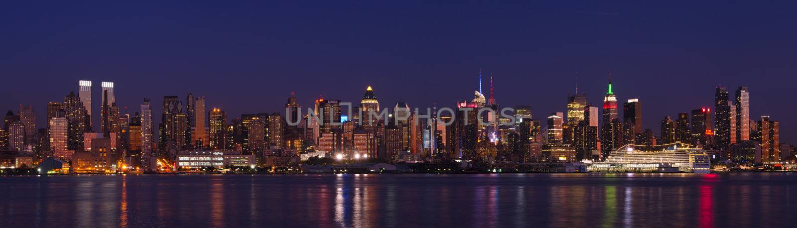 Panorama of Midtown Manhattan skyline and the Hudson River at night, New York City, New York, USA by CharlesBolin