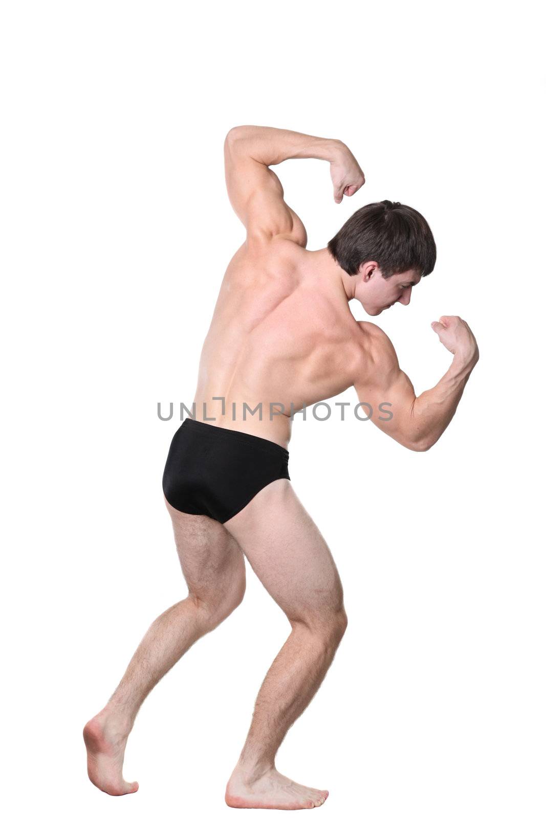 The young body builder poses with greater muscles on a white background