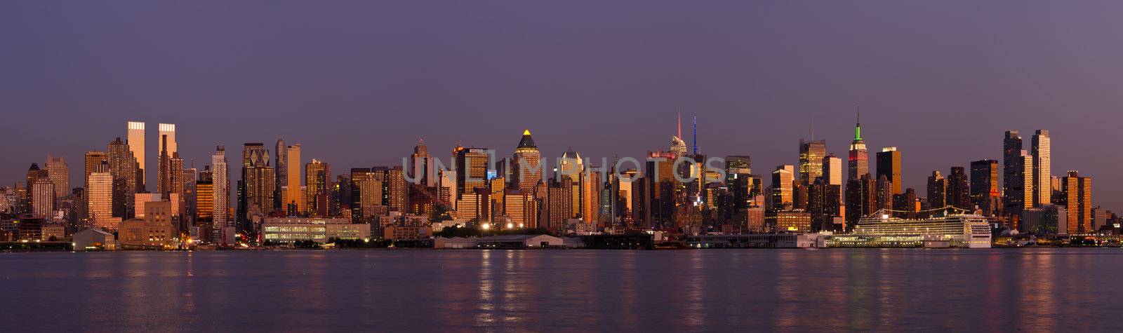 Panorama of Midtown Manhattan skyline and the Hudson River at sunset, New York City, New York, USA by CharlesBolin