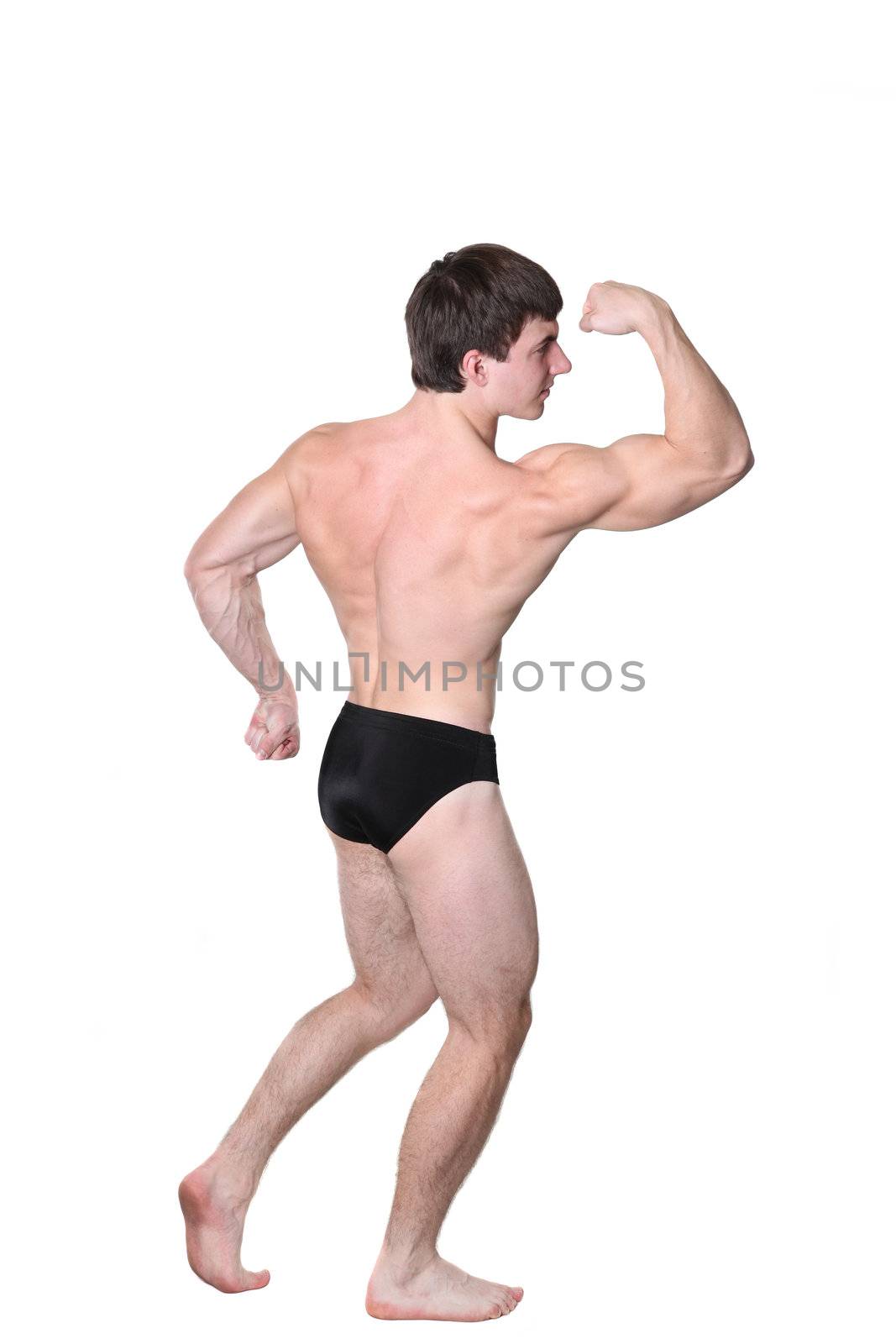 The young body builder poses with greater muscles on a white background