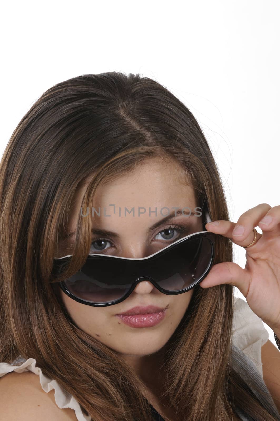 closeup of pretty hispanic model looking over sunglassesisolated on white