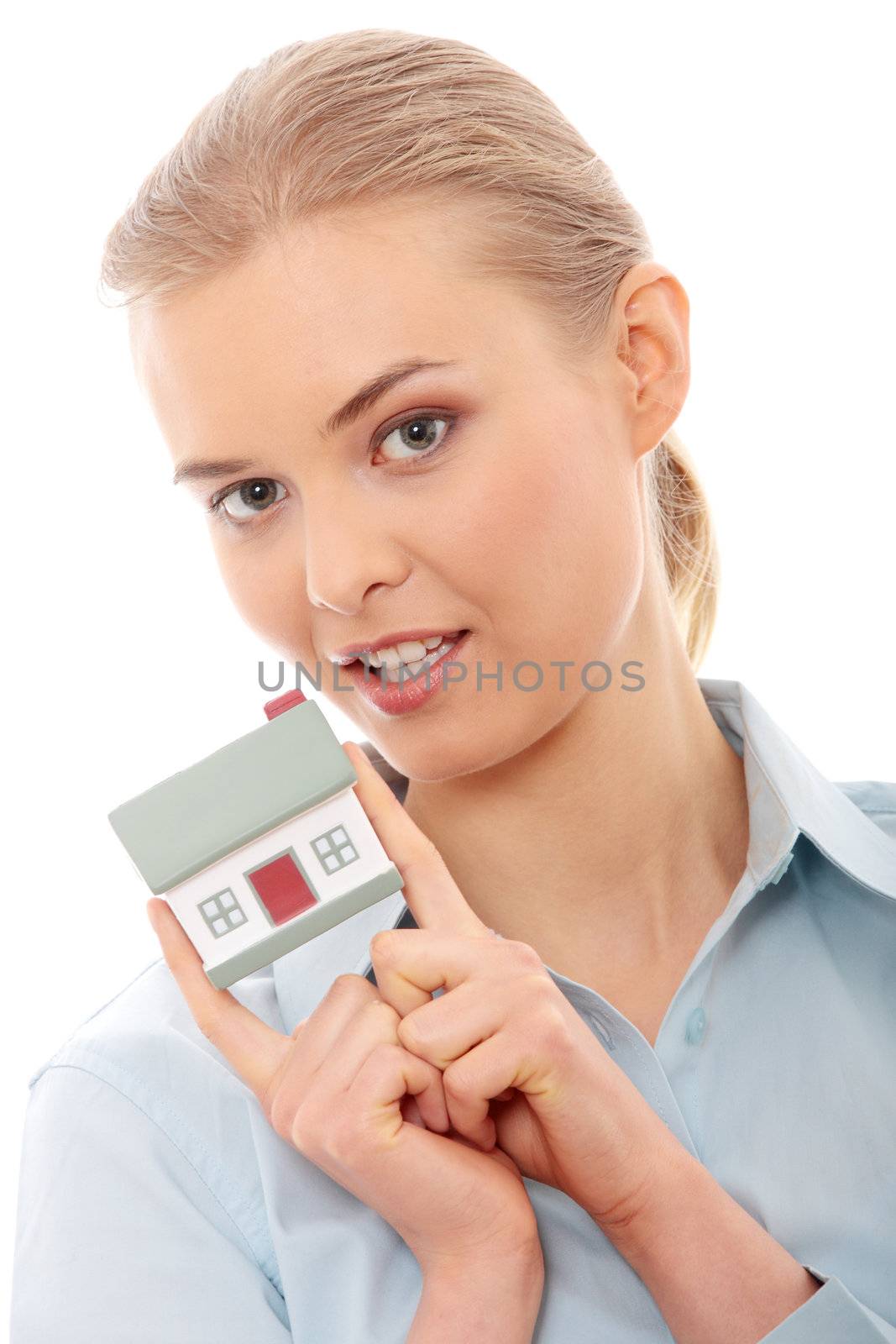 Young beautiful business woman with house model - real estate