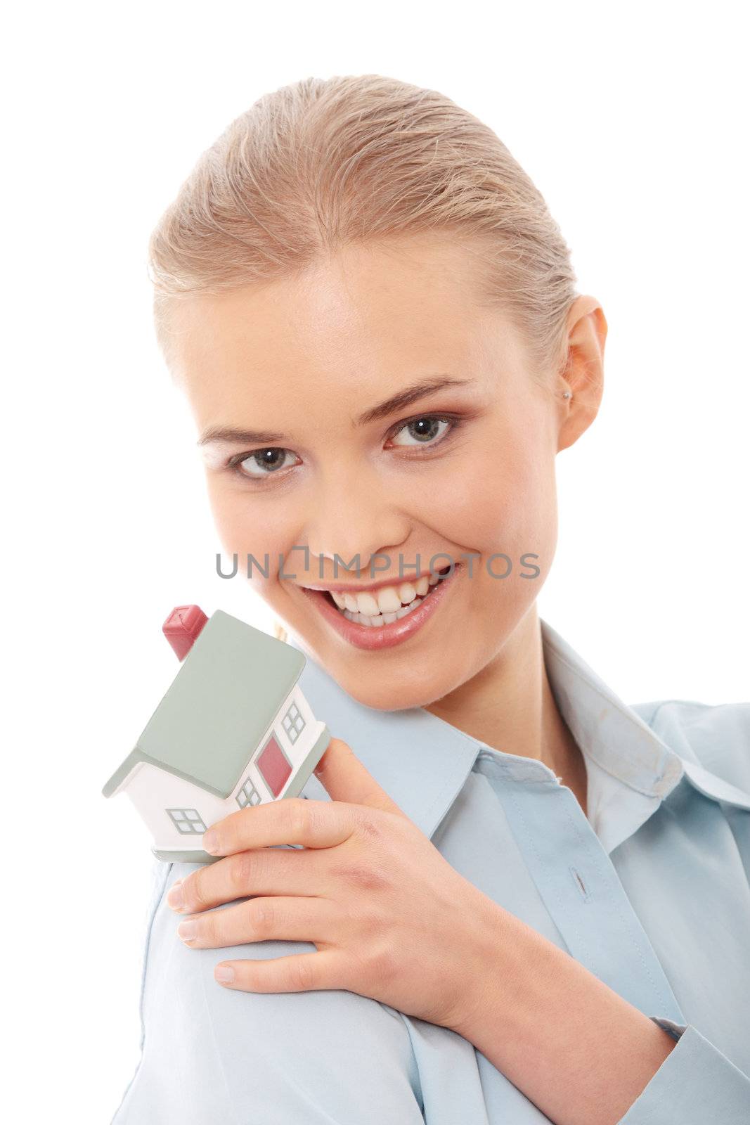 Young beautiful business woman with house model - real estate