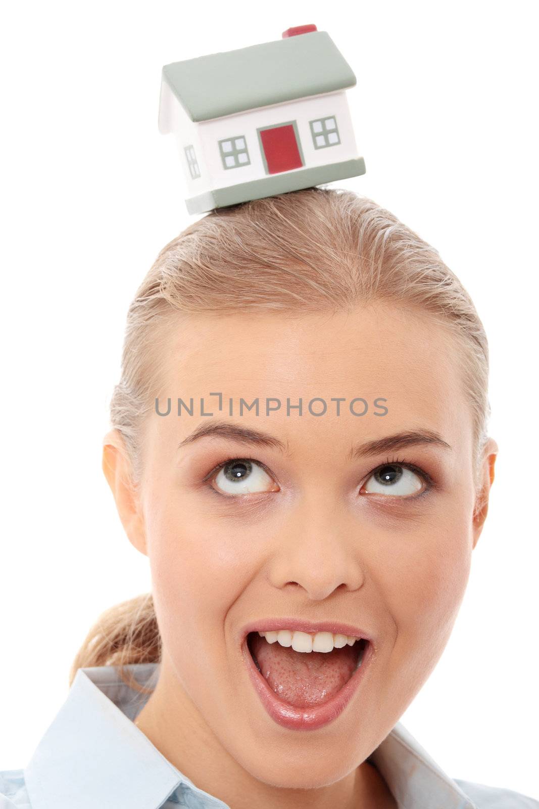 Young beautiful business woman with house model - real estate
