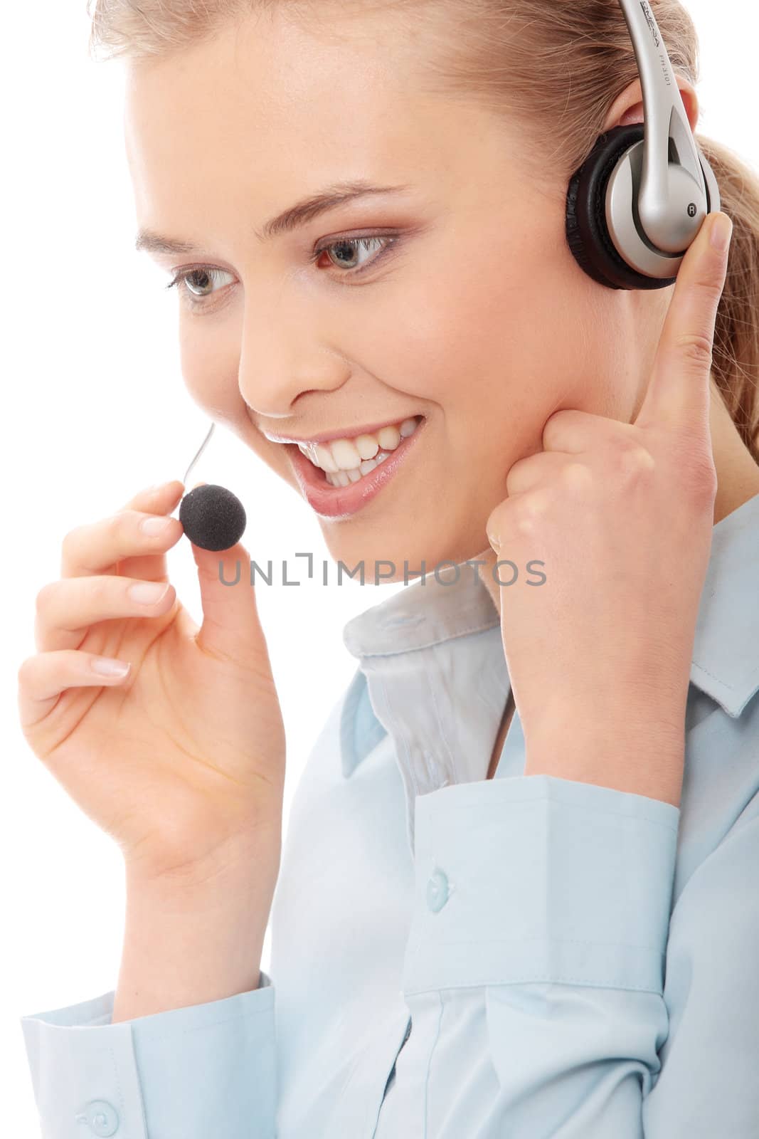 Call center woman with headset. Beautiful smiling caucasian woman isolated on white background.