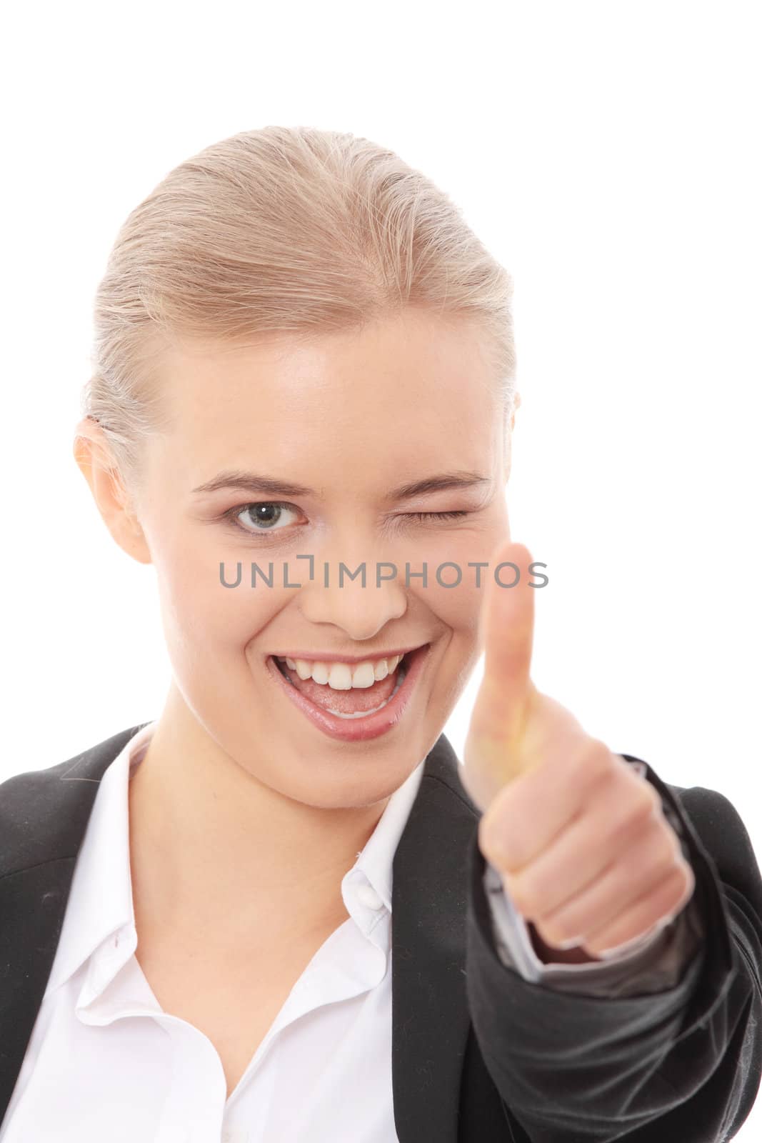Young business woman showing OK sign, looking at camera and smiling. Isolated on white background.