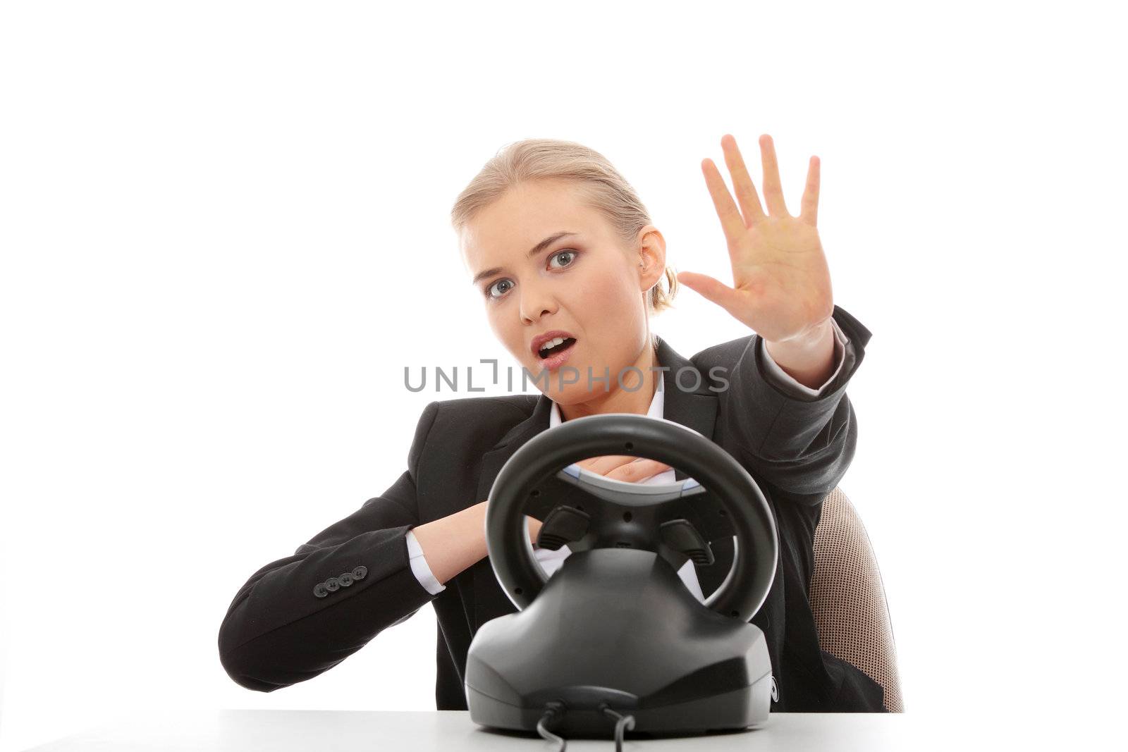 Young caucasian business woman playing on computer (with steering wheel), isolated on white background