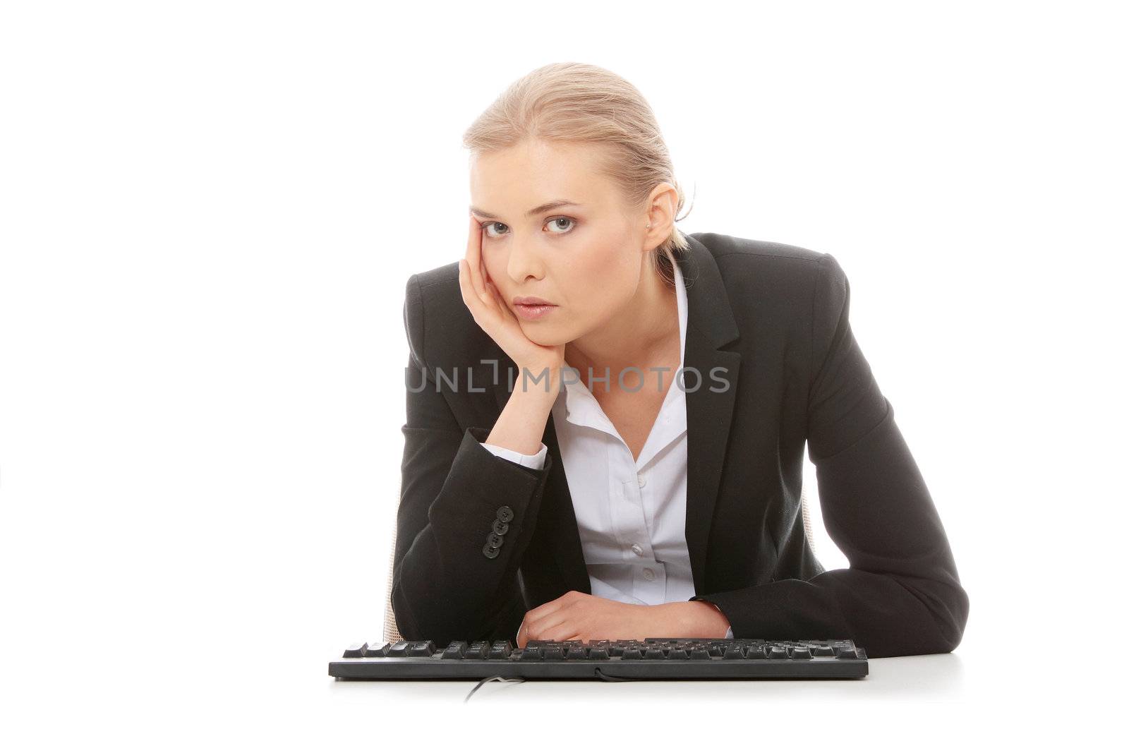 Bored businesswoman working on pc, isolated on white background