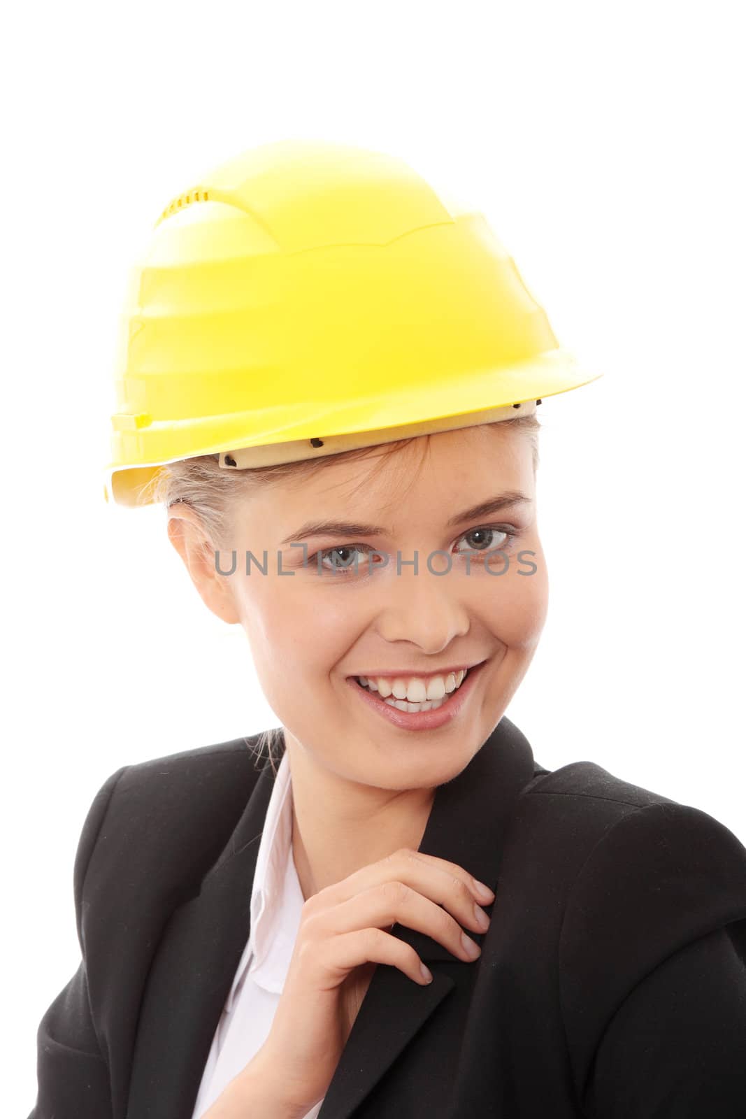 Portrait of confident female worker in helmet isolated on white background