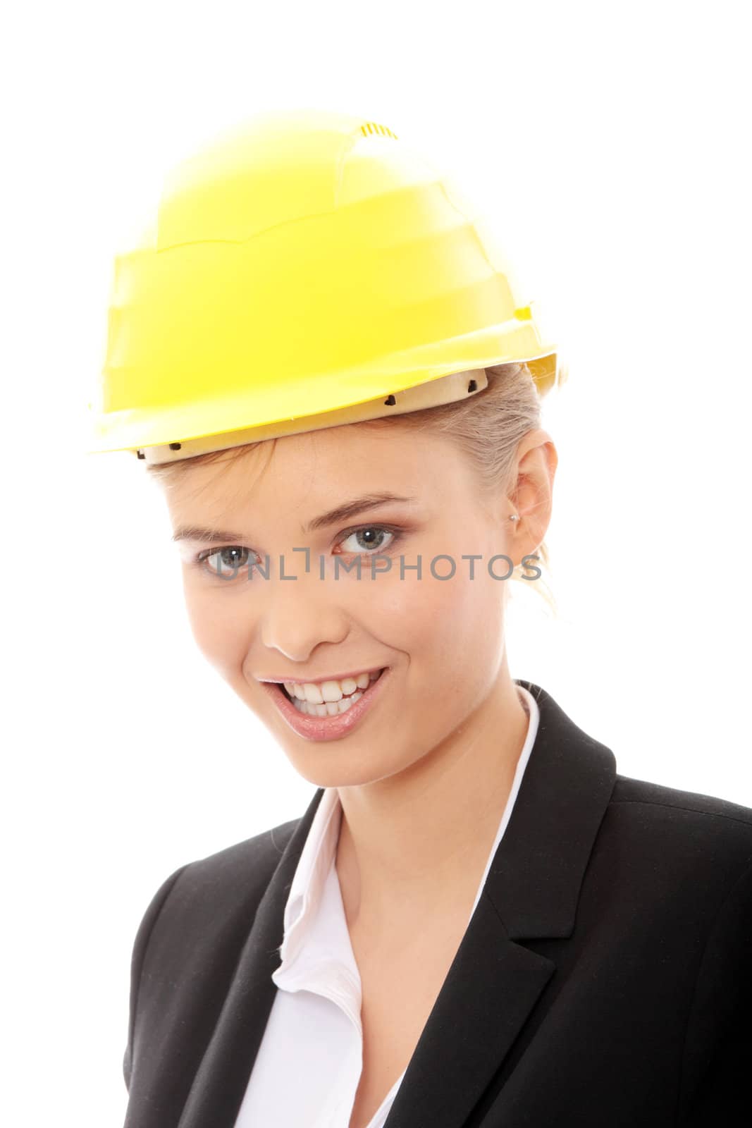 Portrait of confident female worker in helmet isolated on white background