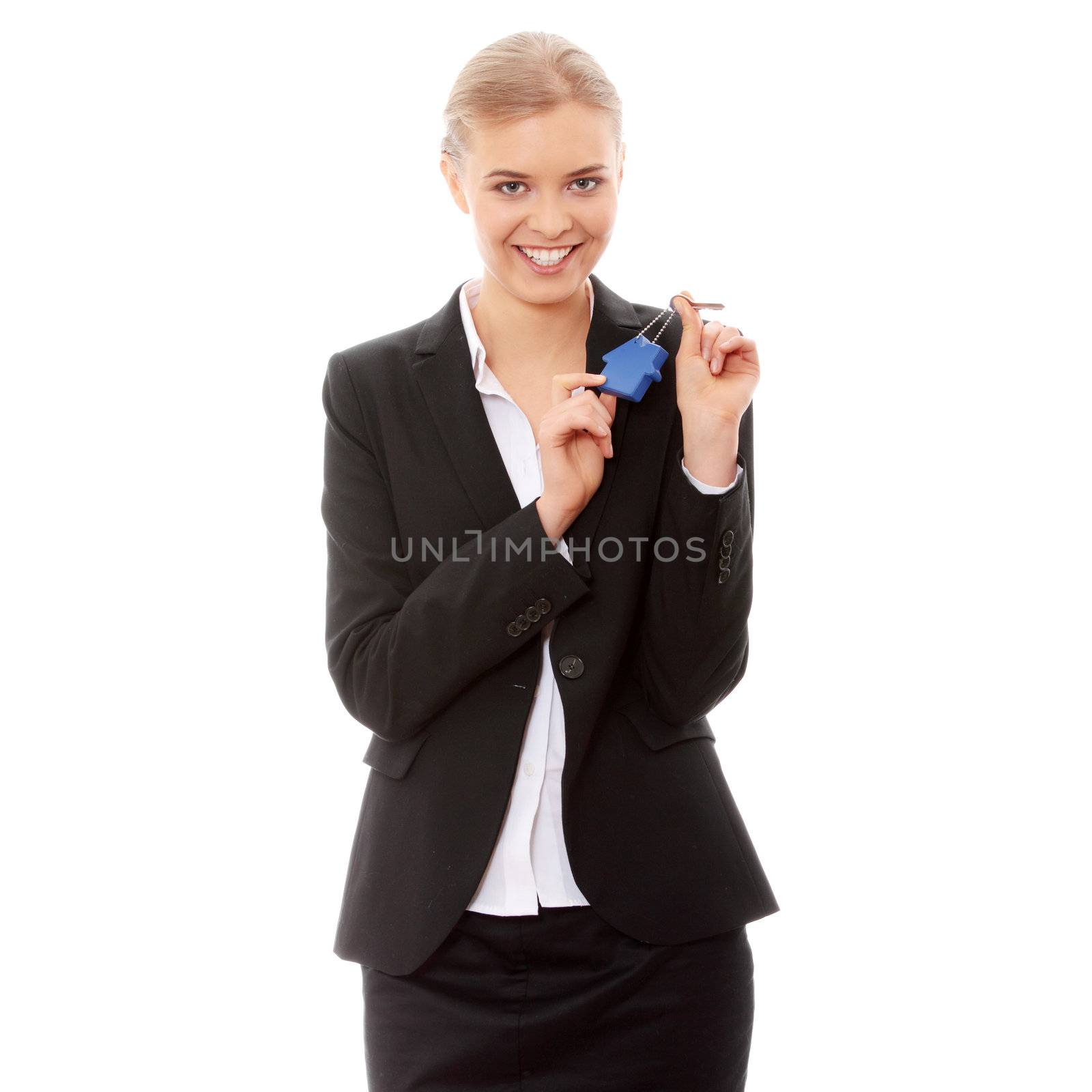 Young businesswoman holding house shaped key chain, isolated on white background