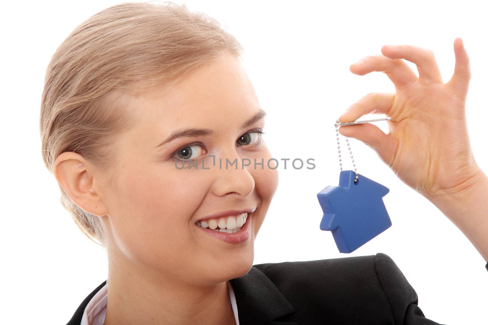 Young businesswoman holding house shaped key chain, isolated on white background